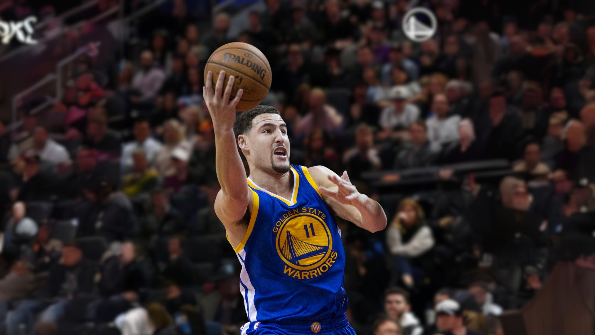 Basketball Player Number 11 Klay Thompson Holding A Ball
