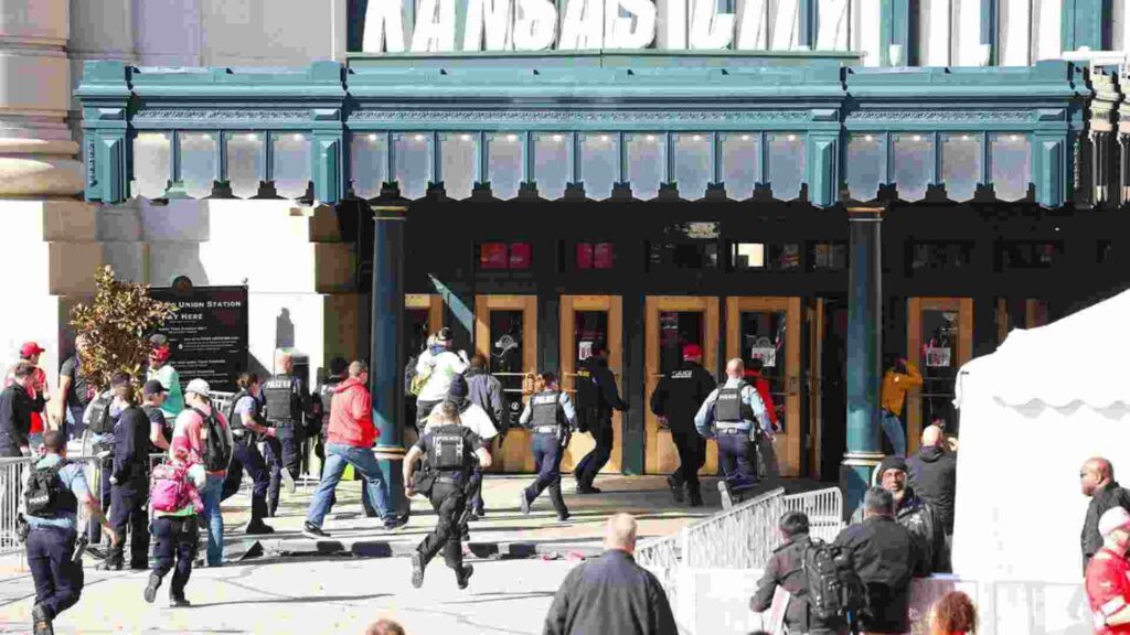 Photage of police running towards the building during the parade tragedy