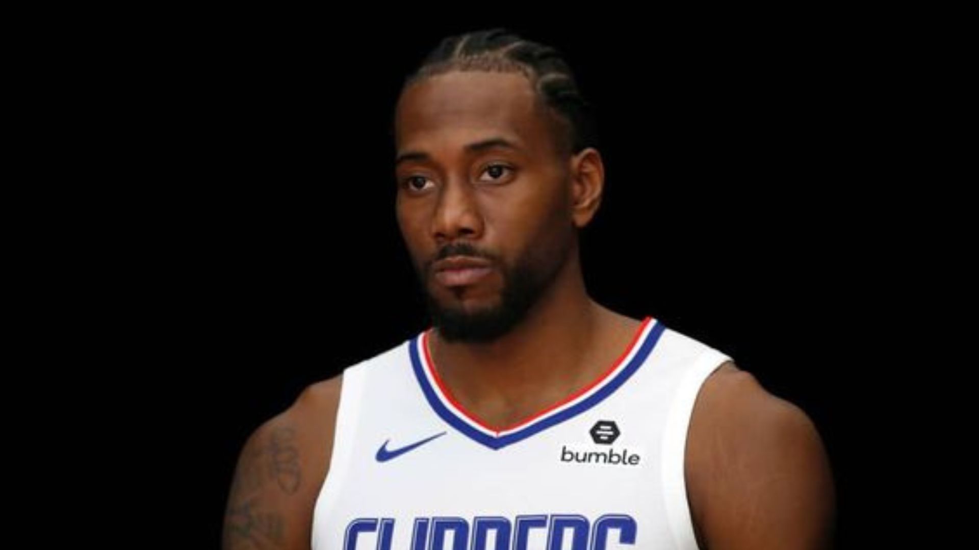 Kawhi Leonard focuses on the interviewer.