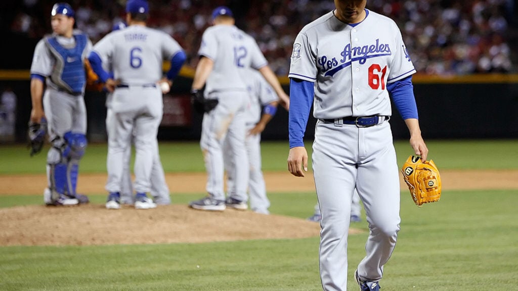 Pitcher Chan Ho Park #61 of the Los Angeles Dodgers is pulled from the game in the sixth inning against the Arizona Diamondbacks