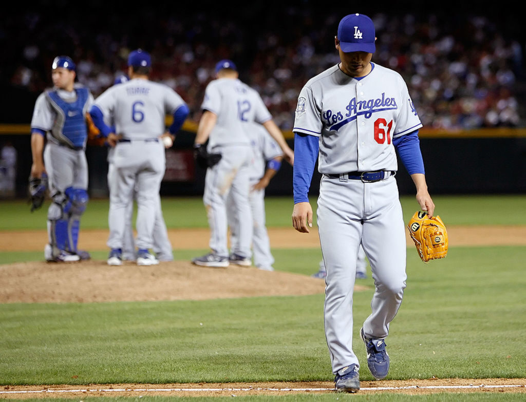 Pitcher Chan Ho Park #61 of the Los Angeles Dodgers is pulled from the game in the sixth inning against the Arizona Diamondbacks